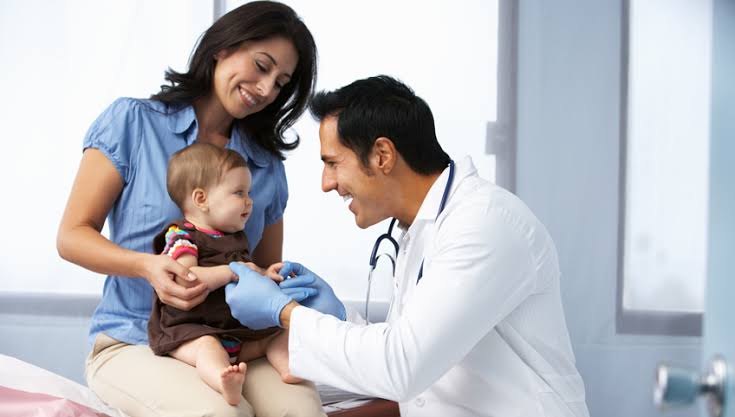 Pediatric doctor with child patient
